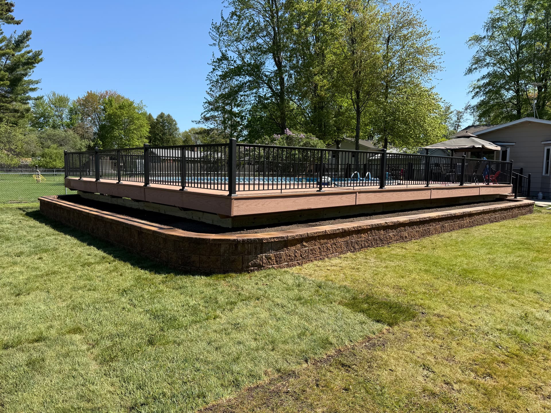 90-Foot Retaining Wall Frames This Backyard Pool Deck image