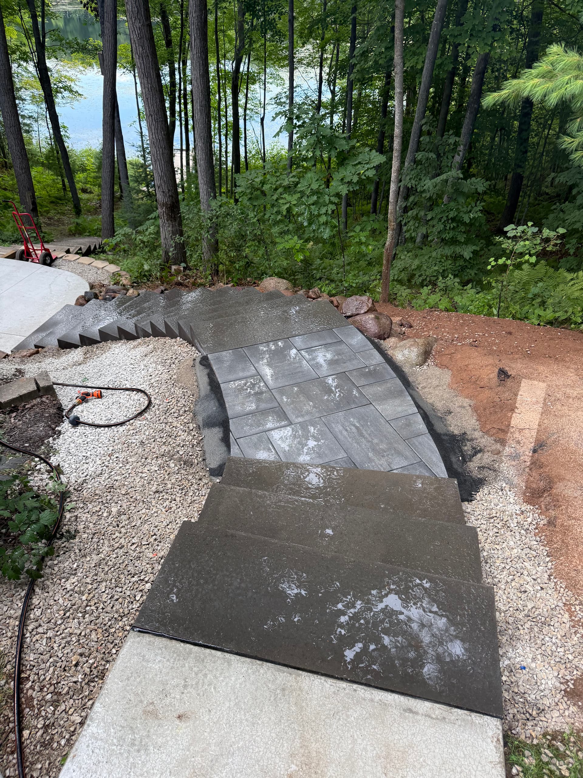 Gallery photos for Concrete Steps and Paver Landing Built Into a Wooded Lakeside Property: Image #1