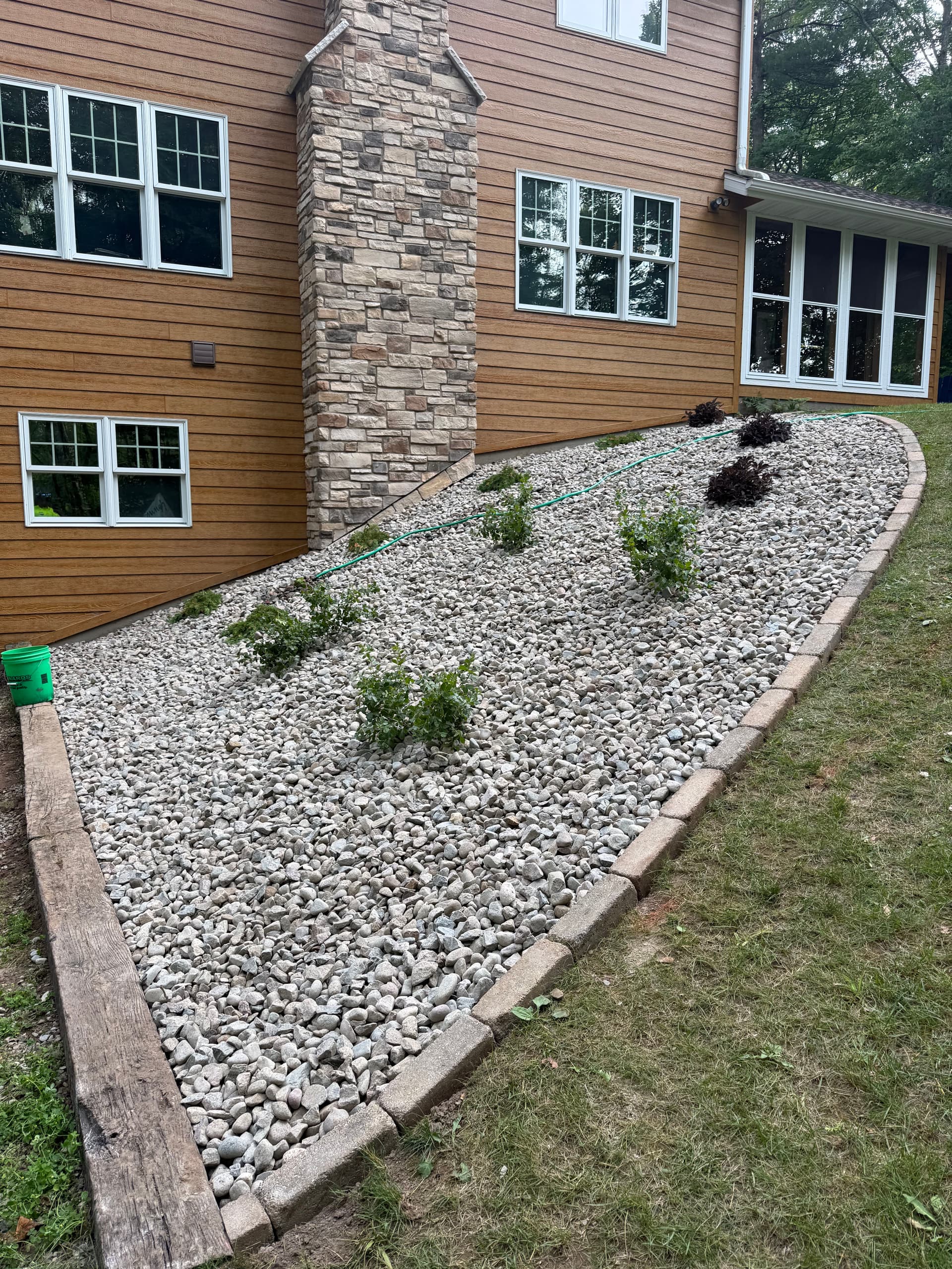 Gallery photos for From Leaf-Covered Mess to Clean Stone Landscape Bed in One Day: Image #1